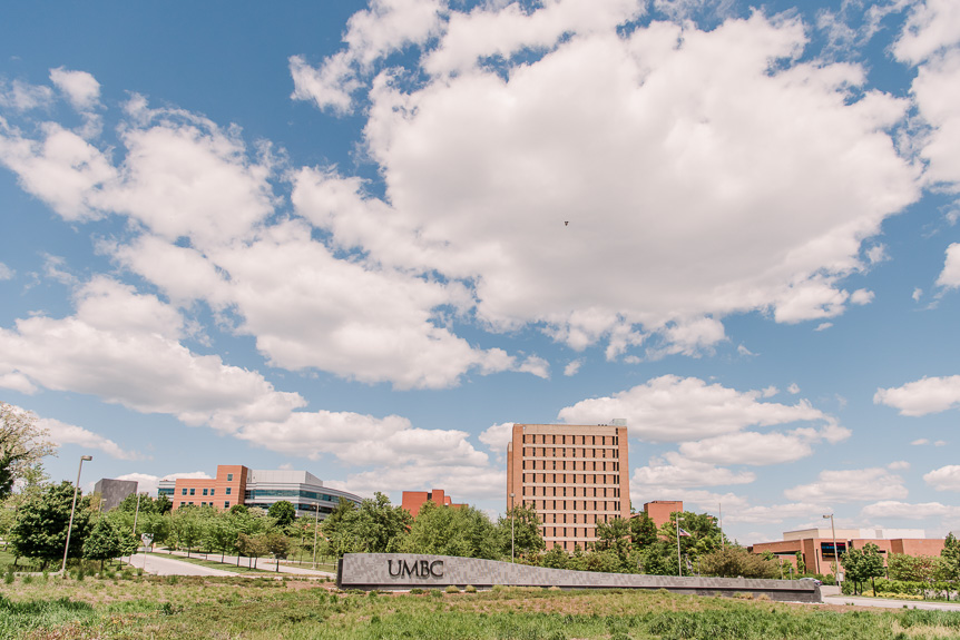 Sample image - photo of UMBC's campus entrance on a summer day