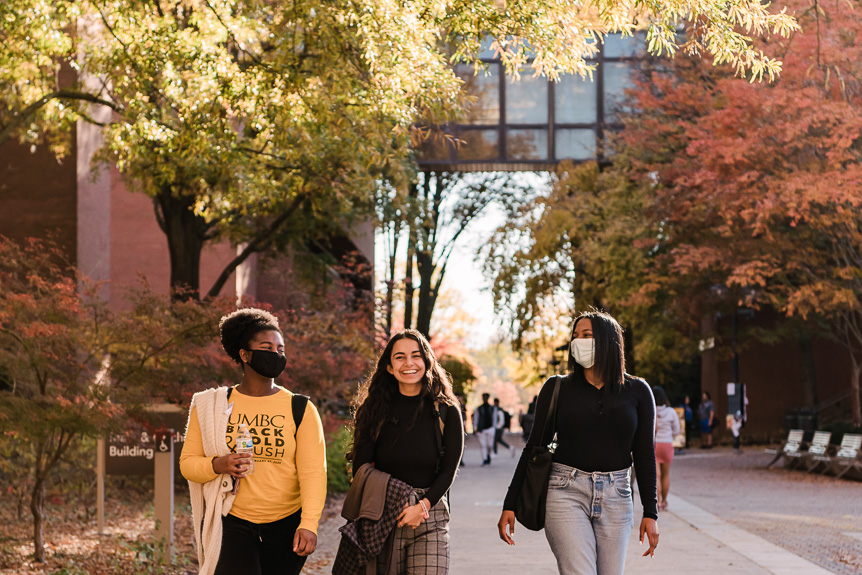 Sample image - 3 students walk down academic row in the fall 